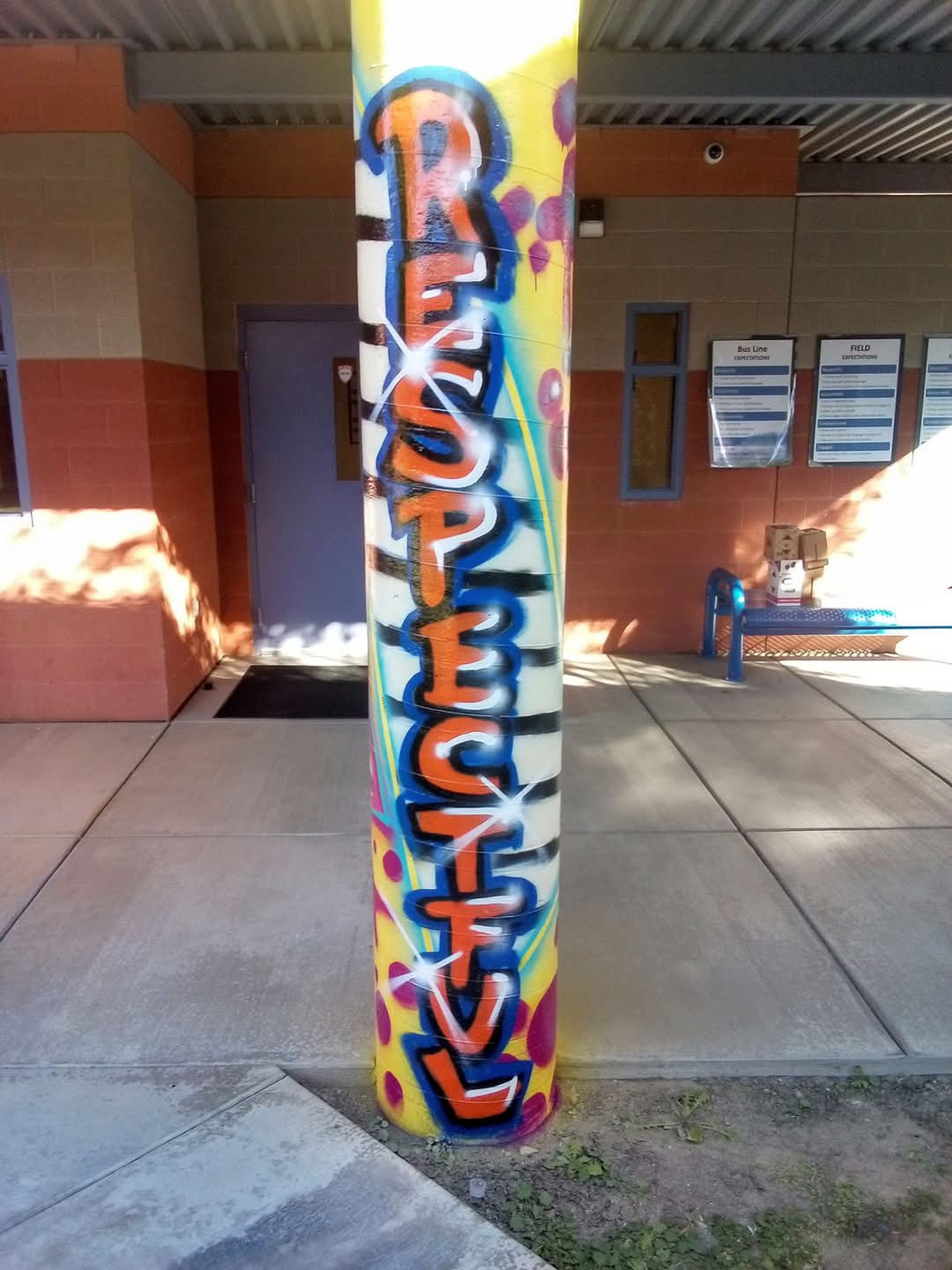 A pillar painted in a street art style featuring the word: Respectful