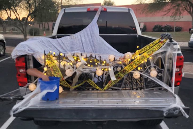 The bed of a pickup truck decorated for Halloween