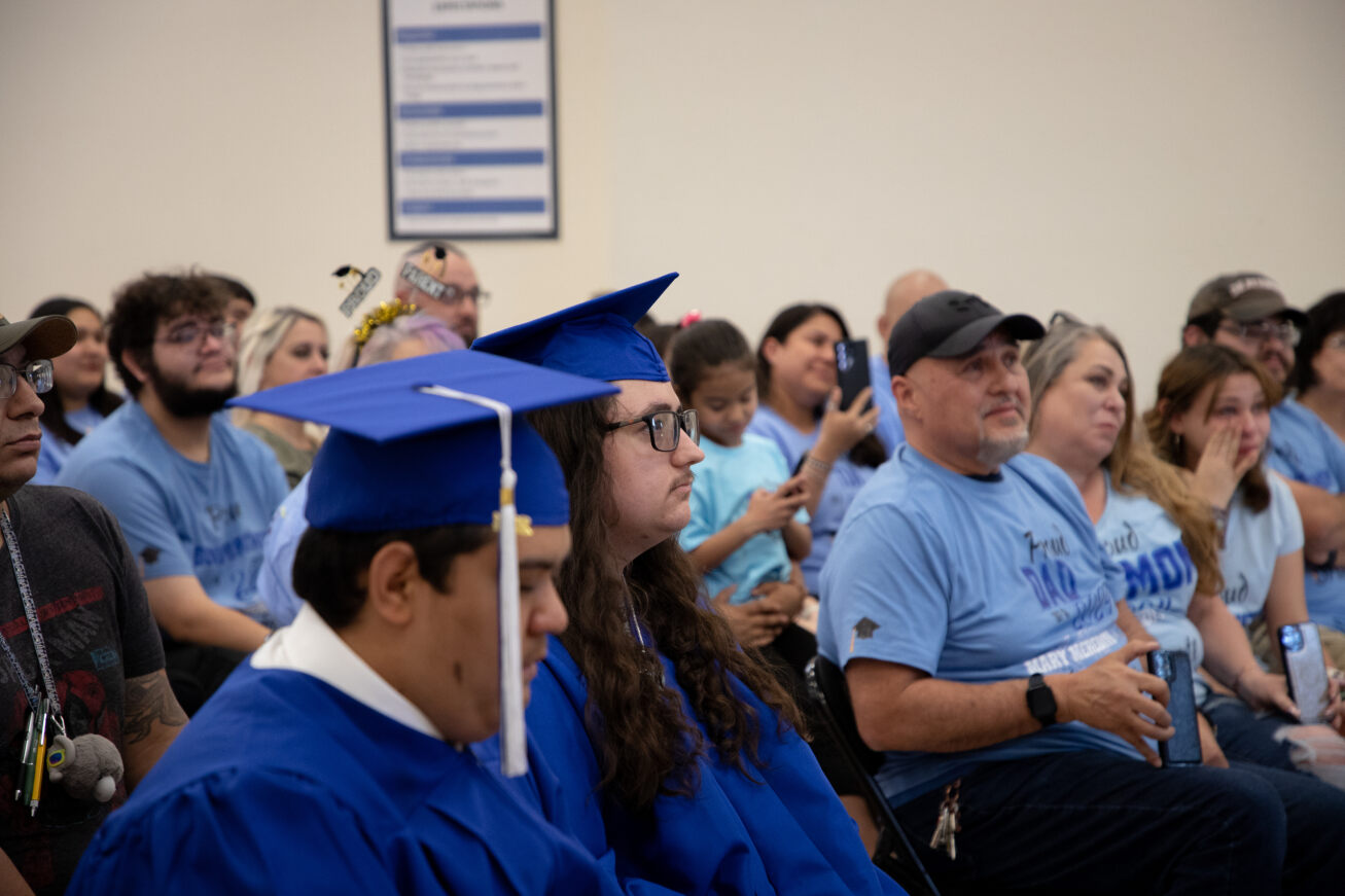 The two Mary Meredith grads sit in the audience 