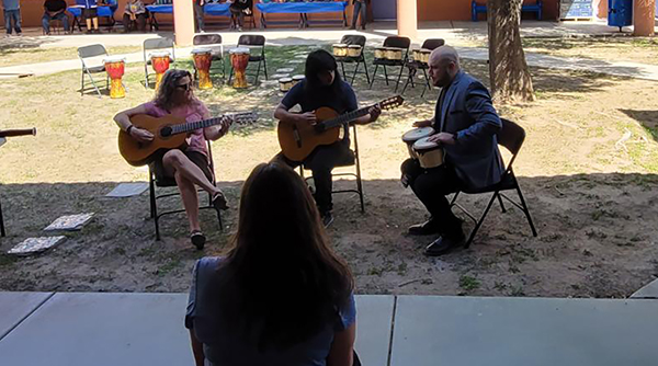 Students playing guitar